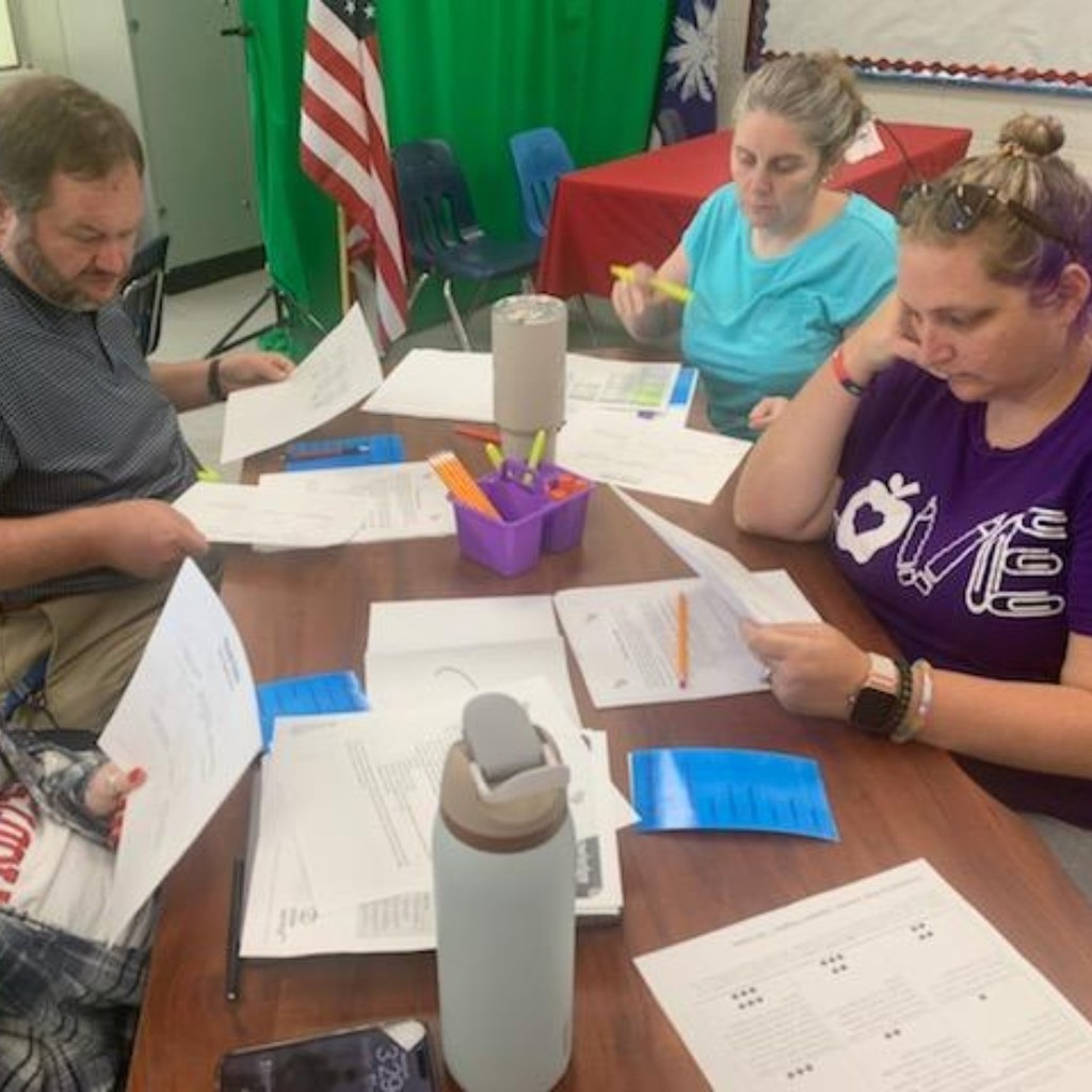 group of teachers discussing 