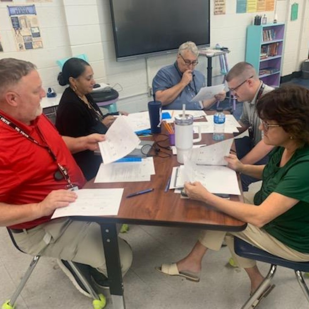 group of teachers discussing 