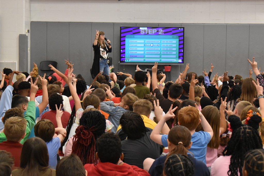 Students giving peace sign.