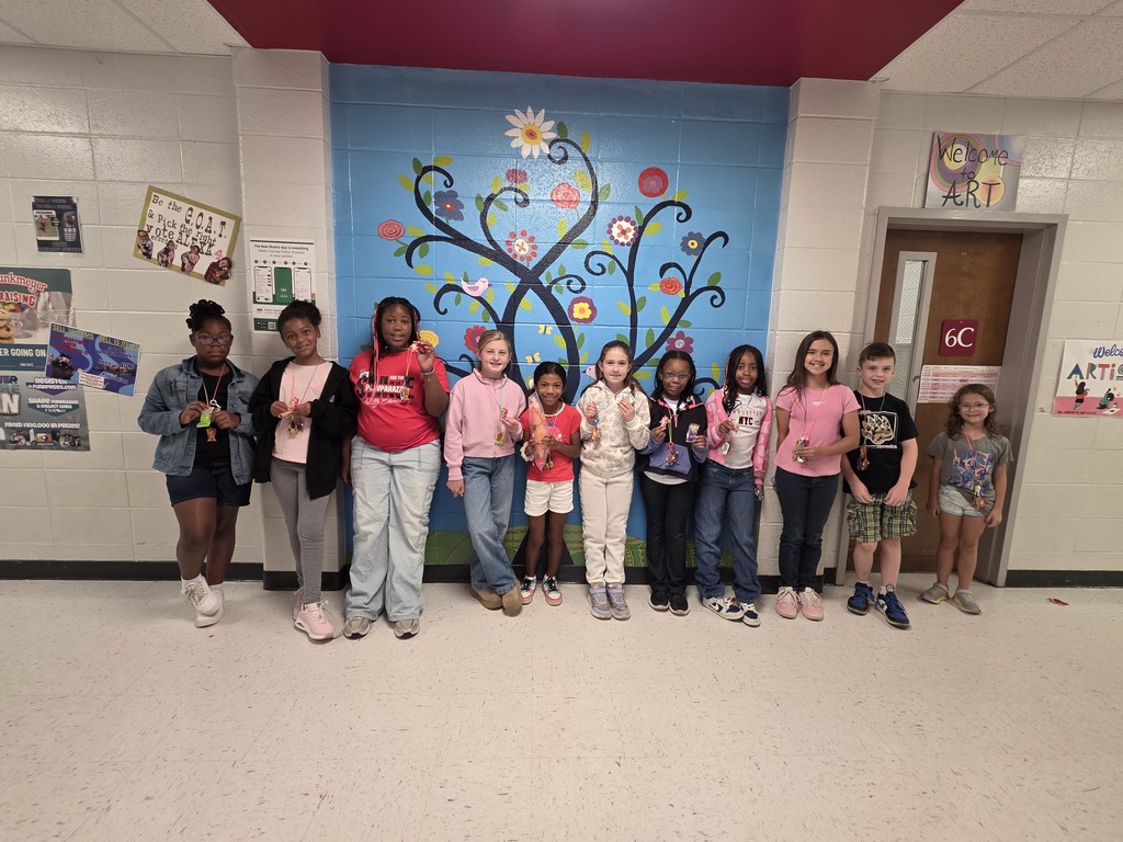 Students holding prizes.