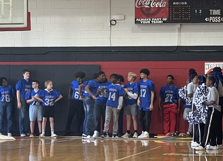 Football team at pep rally.