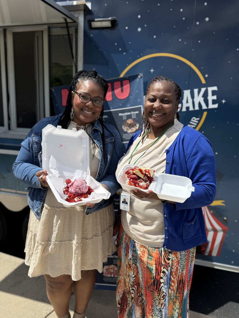 Two ACPSD staff with funnel cakes.