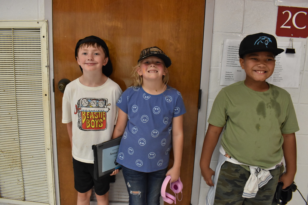 Students wearing hats at school.