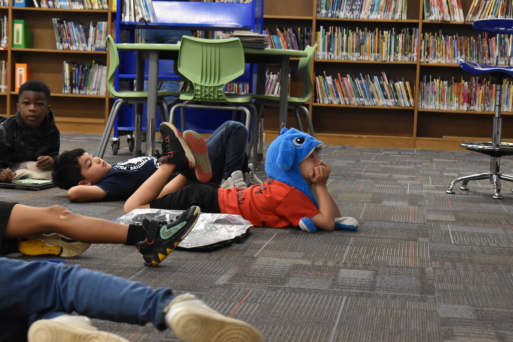 Students wearing hats at school.