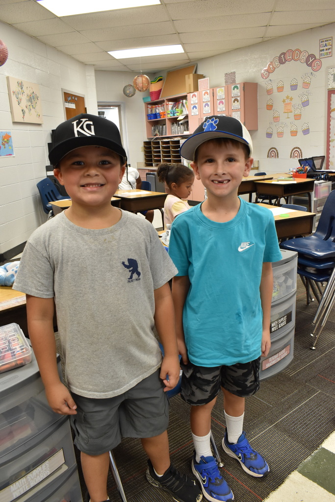 Students wearing hats at school.