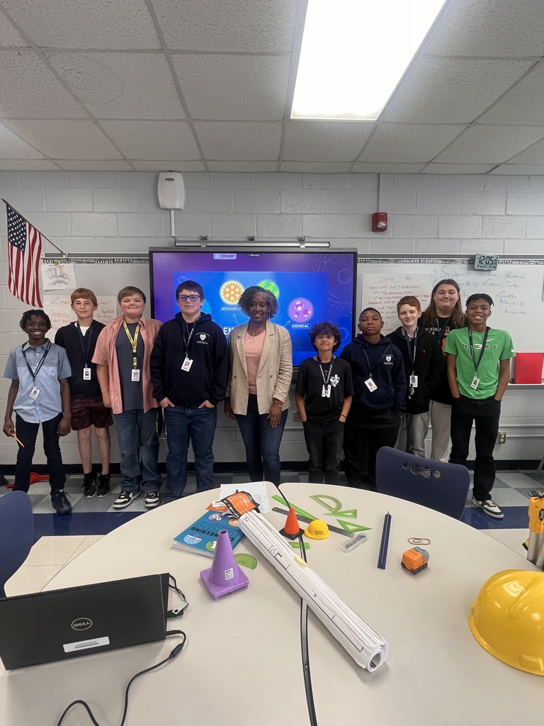 Ms.  Toney standing with several students 