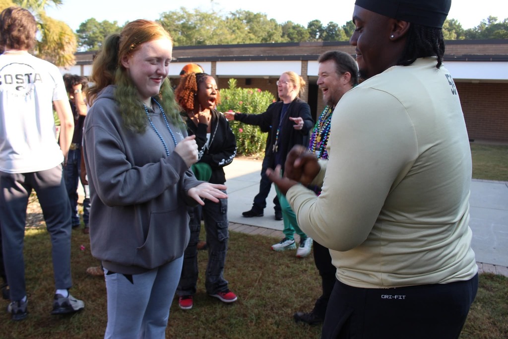 Students playing rock paper scissors