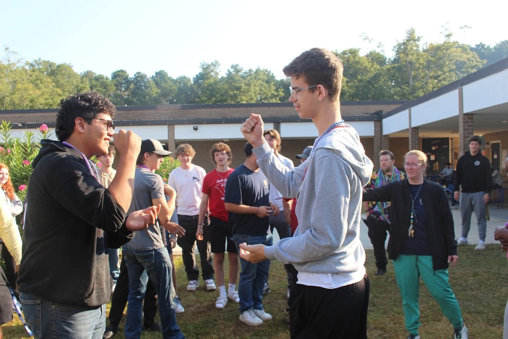 Students playing rock paper scissors