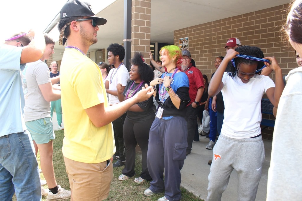 Students playing rock paper scissors