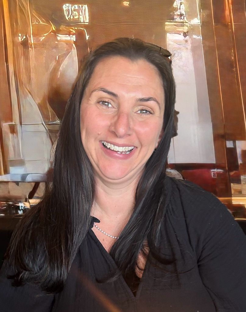 Smiling woman in a black shirt. 