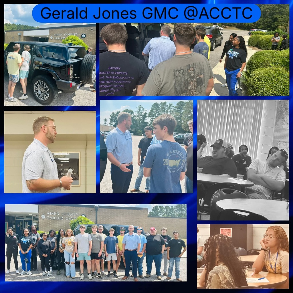 students visiting with gerald jones gmc and looking at the new hummer EV