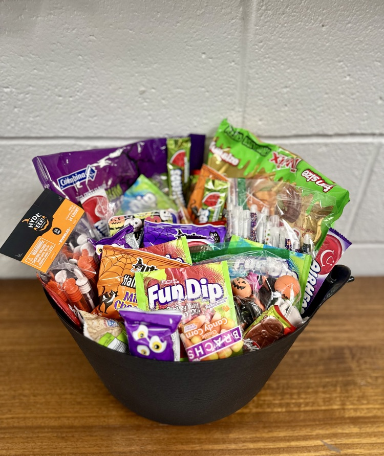 Black cauldron filled with candy and goodies