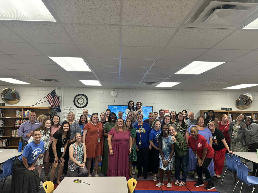 2025 NAUES Staff celebrating a teacher