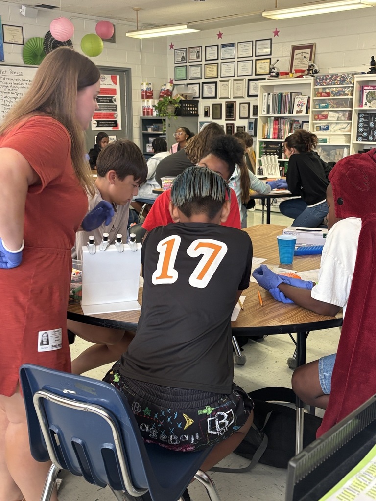 STEM students collaborating on an allergies experiment.