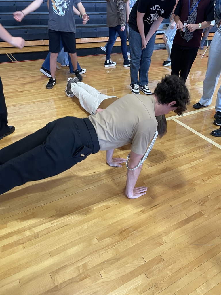 Two brothers in a push-up contest during the NJROTC presentation.