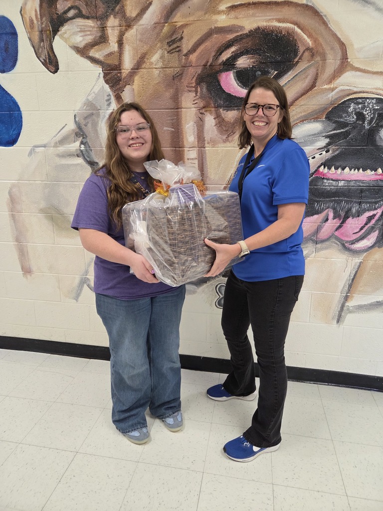 Mackenzie Miller and Ms. Kolmar with a fall gift basket