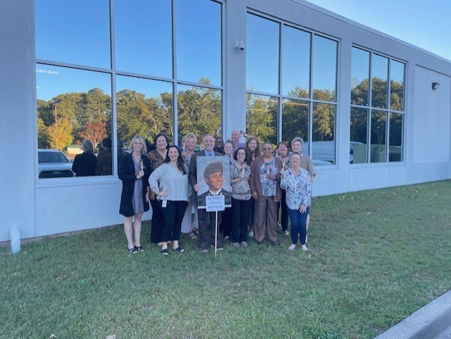 Group of employees surrounding the best boss!