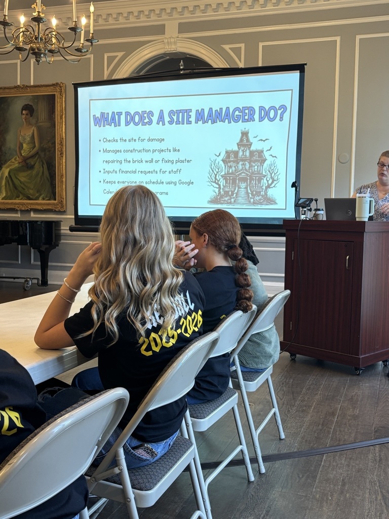 Students attending a presentation on STEM careers in the museum field.