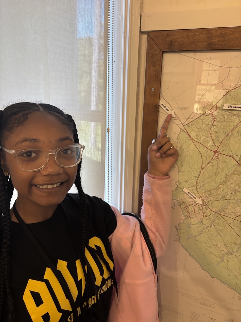 Student viewing museum display of a map.