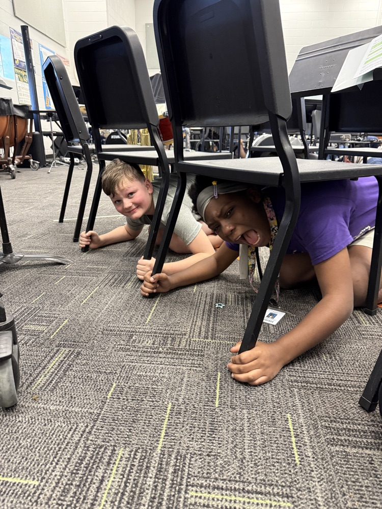 students under a chair 