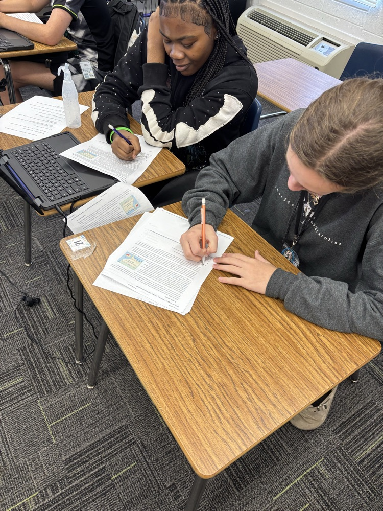 student sitting in desk working 