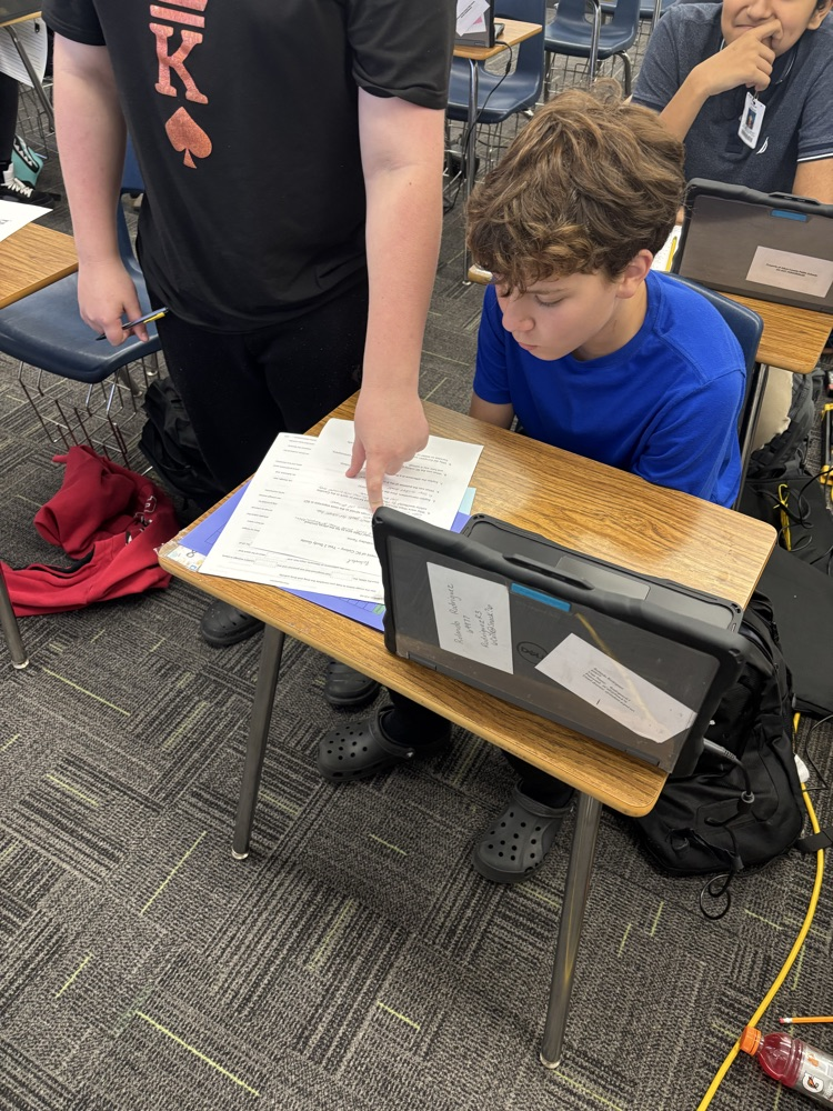 student sitting in desk working 