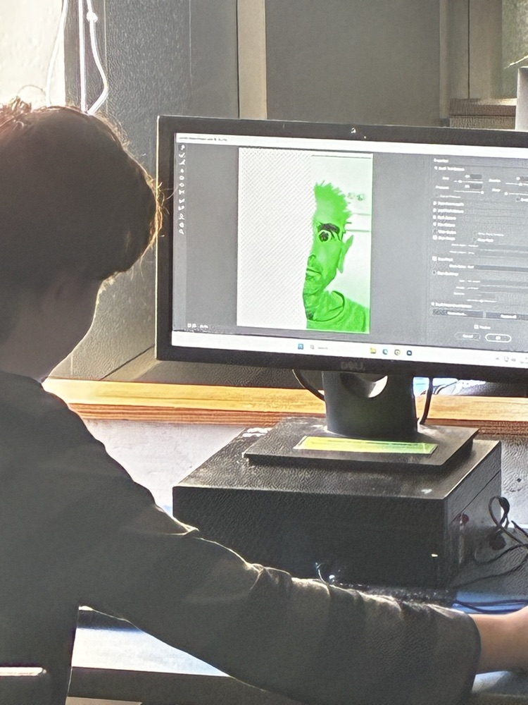 student using computer to create a portrait 