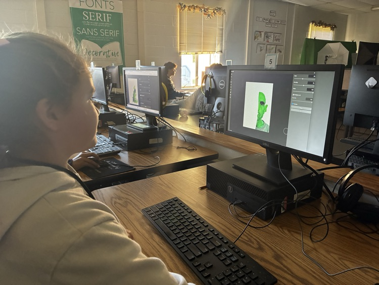 student using computer to create a portrait 