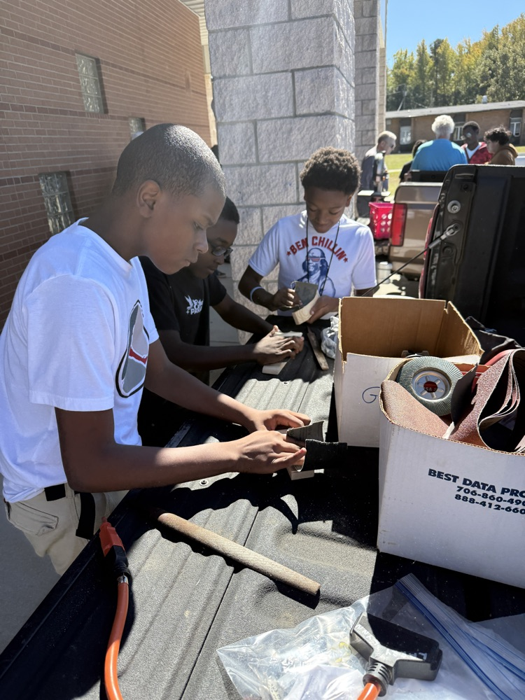 student working on race car project 