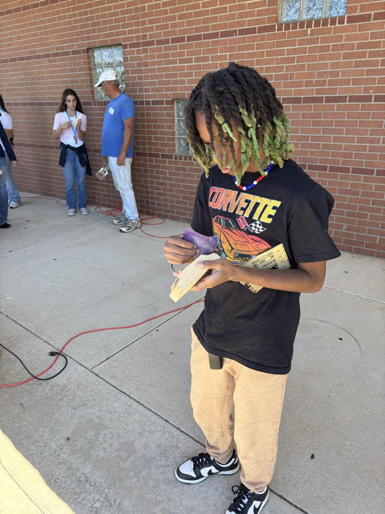 student working on race car project 