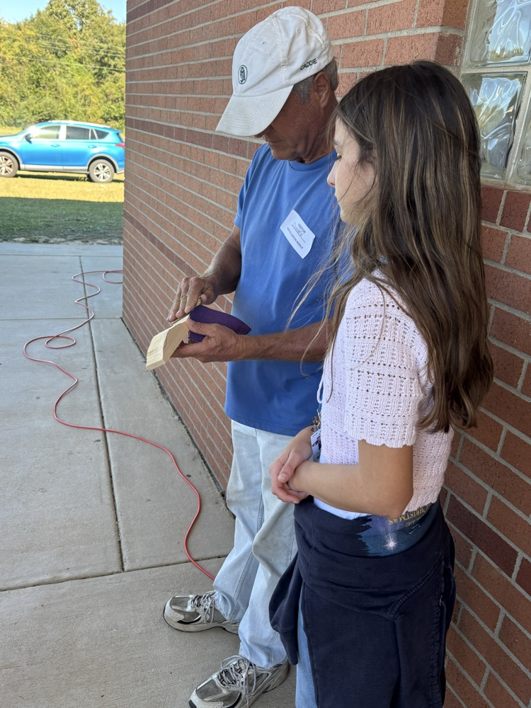 student working on race car project 