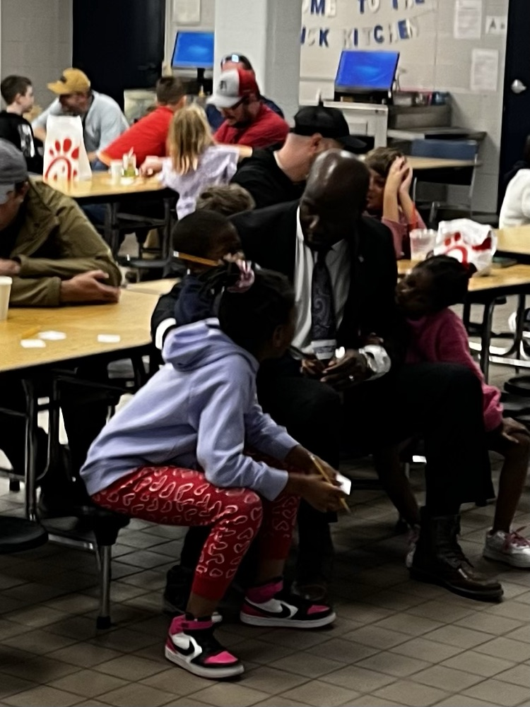 A dad and his children participate in the program .