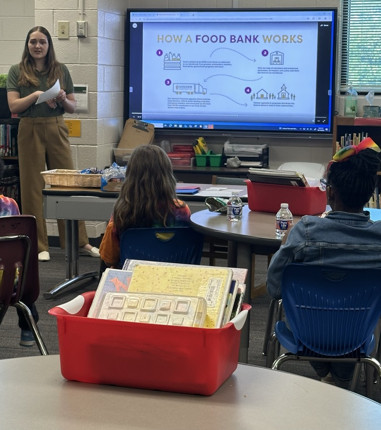 Speaker Nora Ruotolo of the Golden Harvest Food Bank speaking to students of Warrenville Cares Club