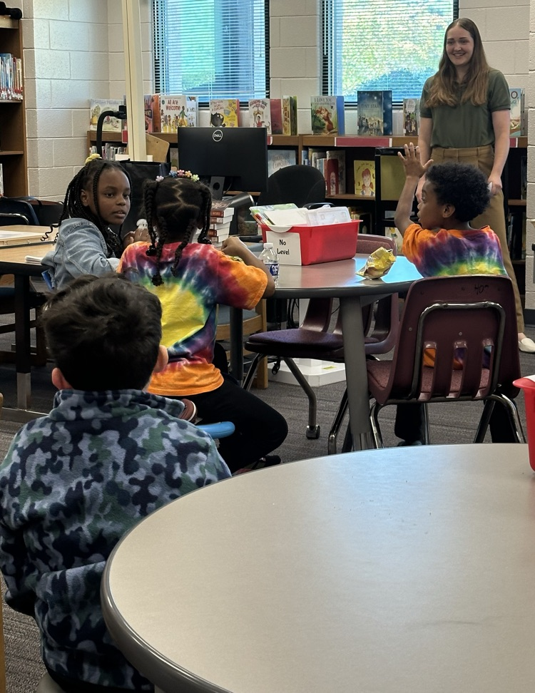 Speaker Nora Ruotolo of the Golden Harvest Food Bank speaking to students of Warrenville Cares Club