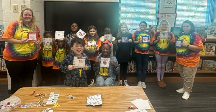 Warrenville Cares Club with cards that will be sent to soldiers.
