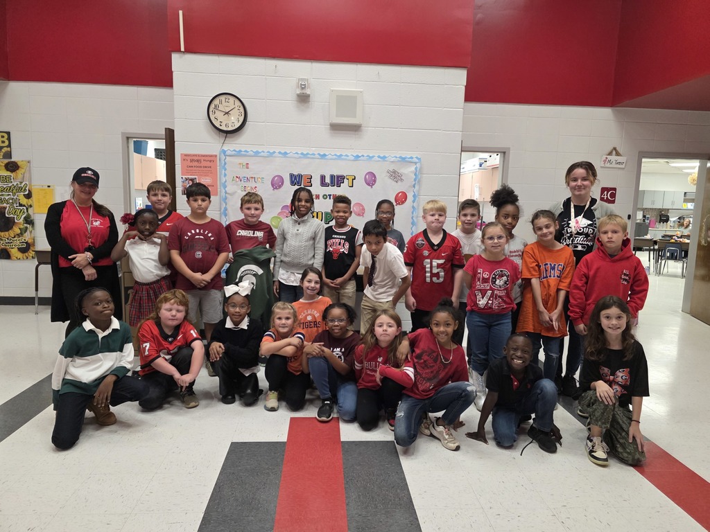 Students and staff dressd in college gear.