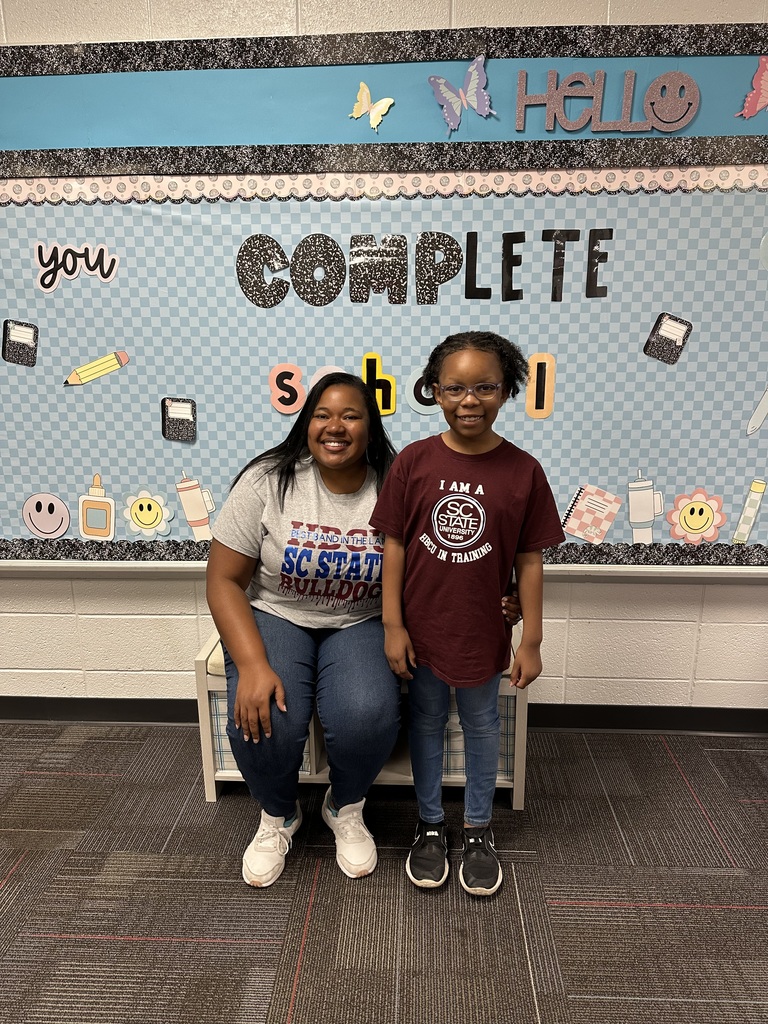 Students and staff dressd in college gear.