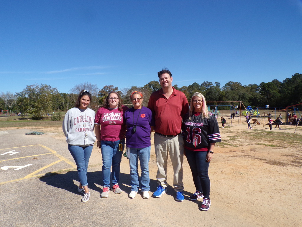 Staff dressd in college gear.