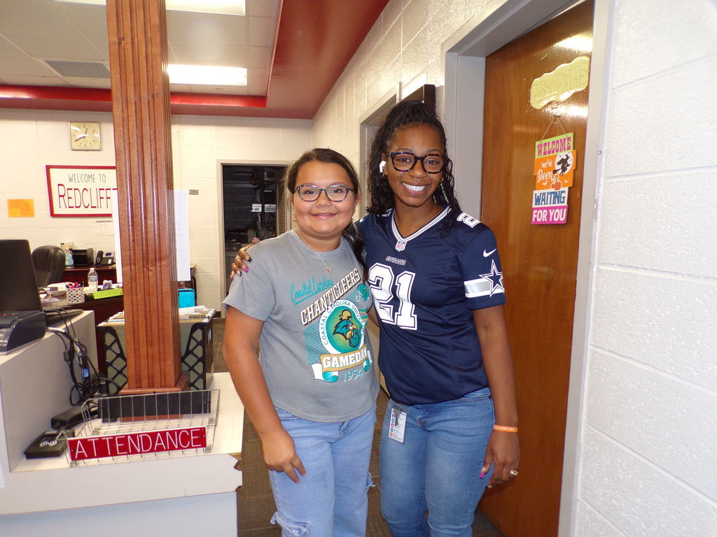Students and staff dressd in college gear.
