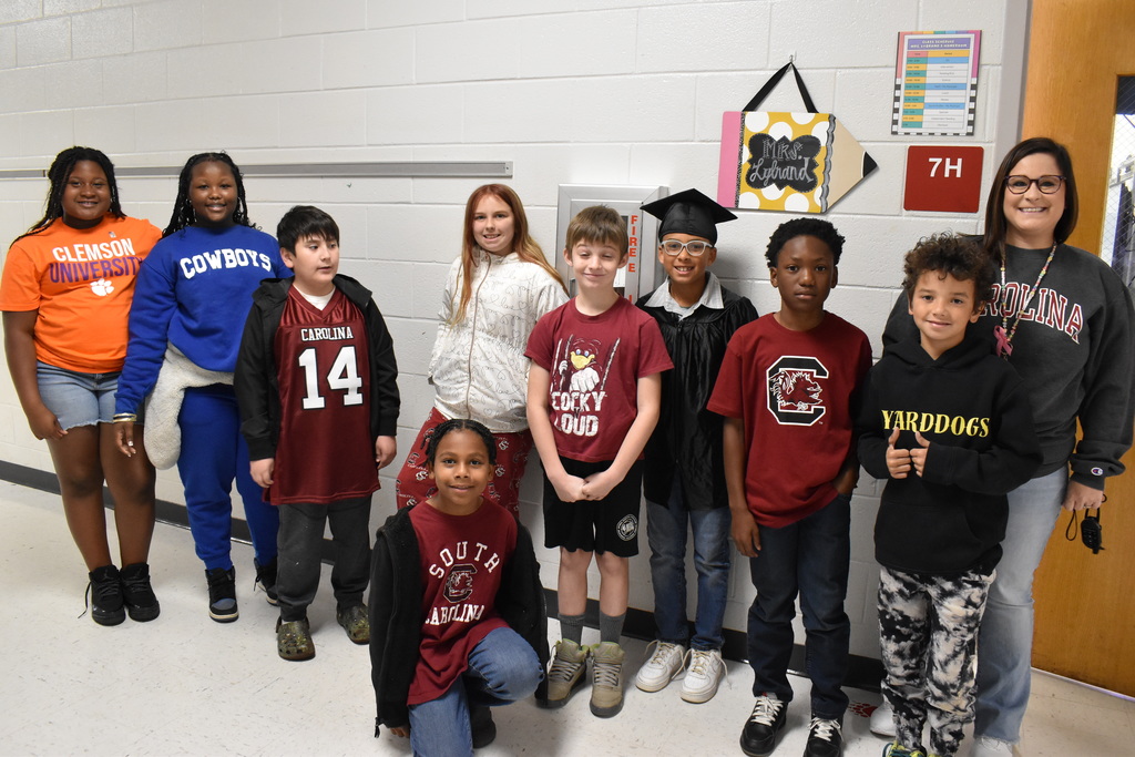 Students and staff dressd in college gear.