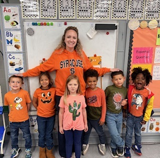 Teacher and students dressed in orange for Unity Day.