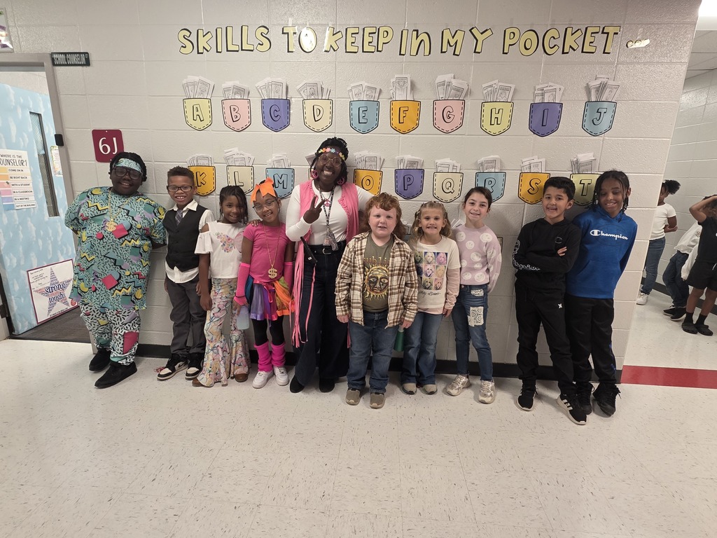 Students and staff dressed from various decades.