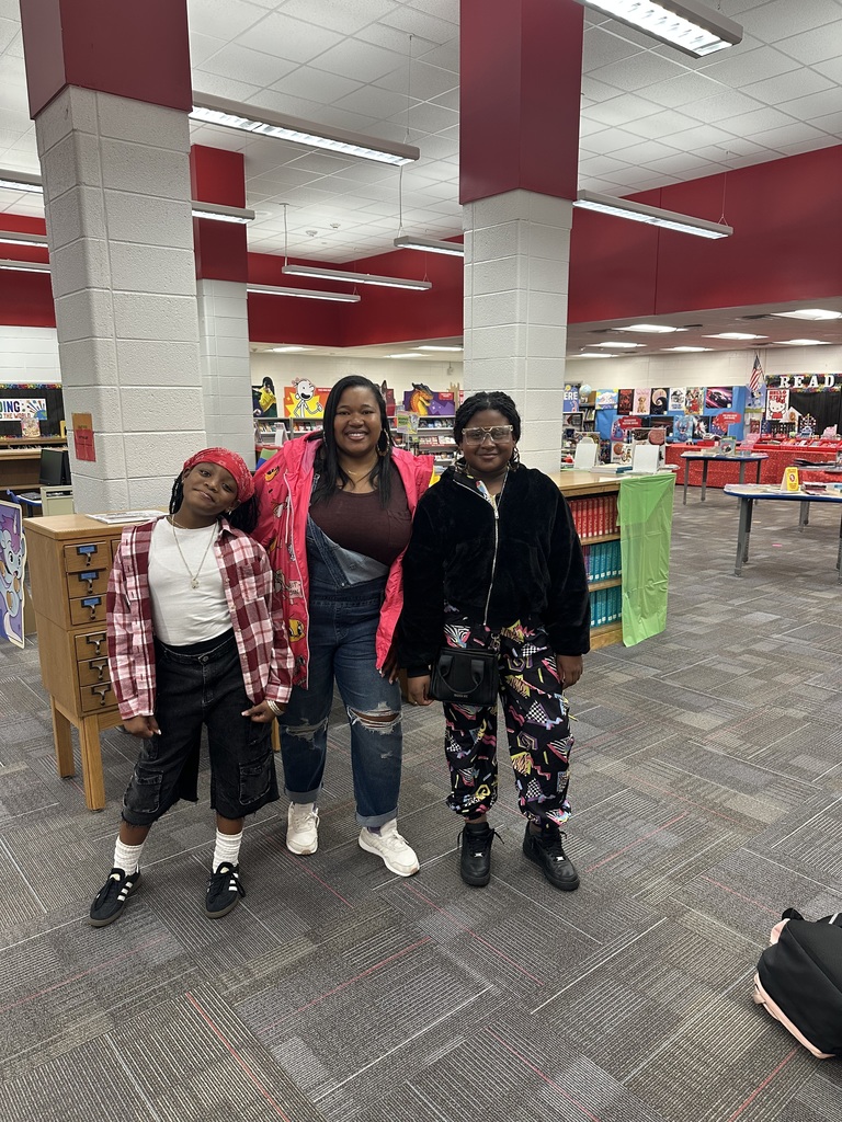 Students and staff dressed from various decades.