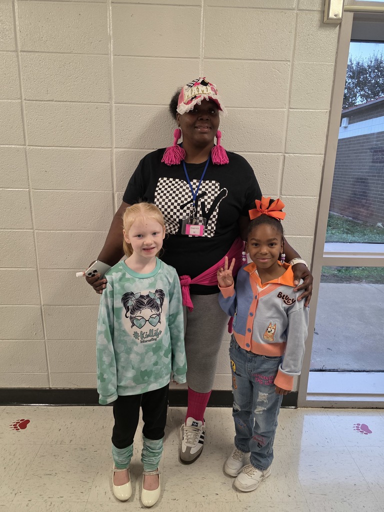 Students and staff dressed from various decades.