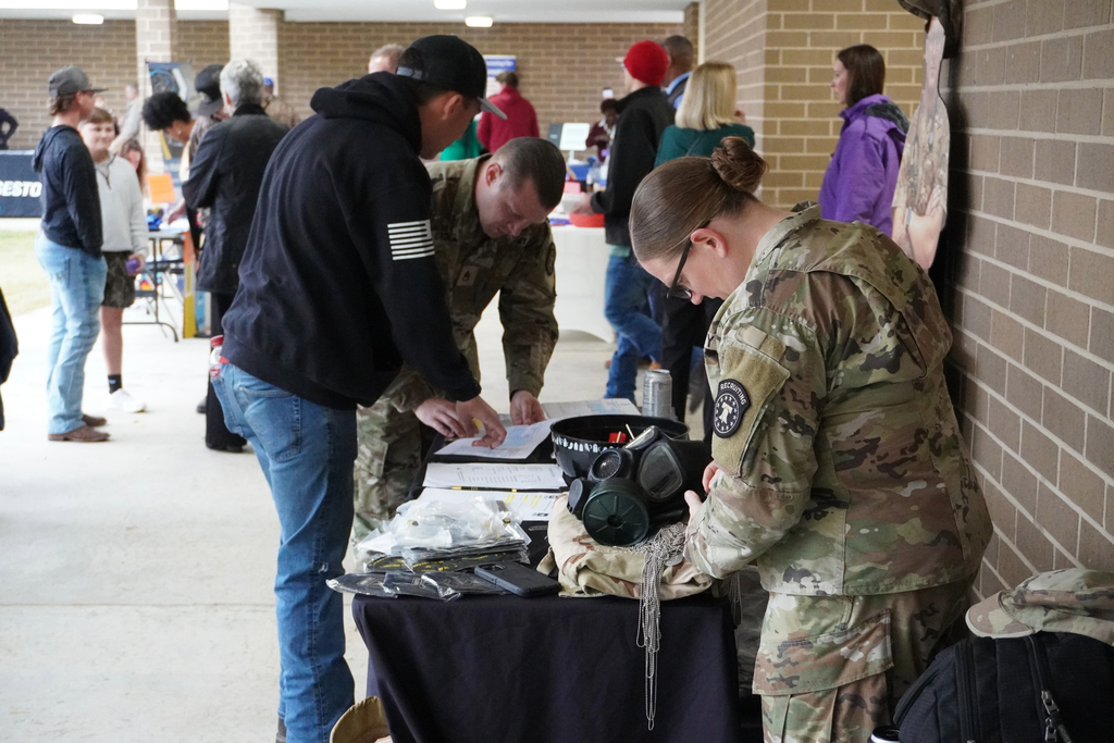 Students and guests visiting Booths set up at Community Night at ACCTC.