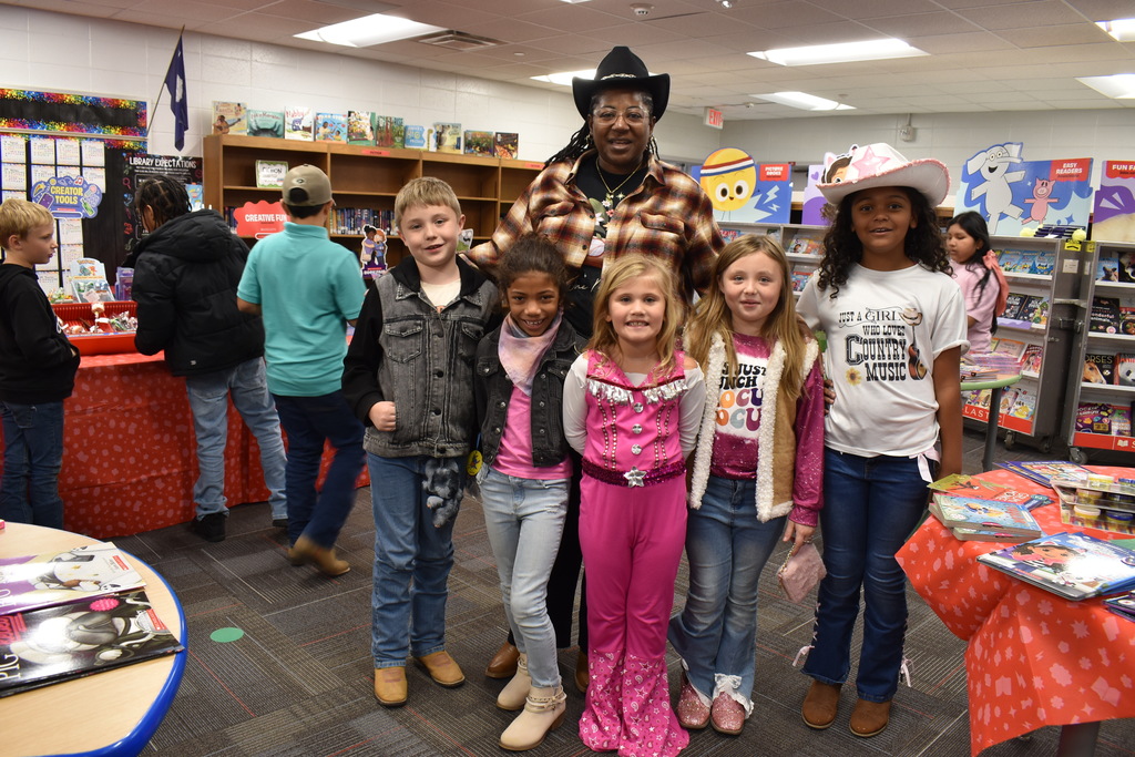 Students and staff dressed in western outfits.