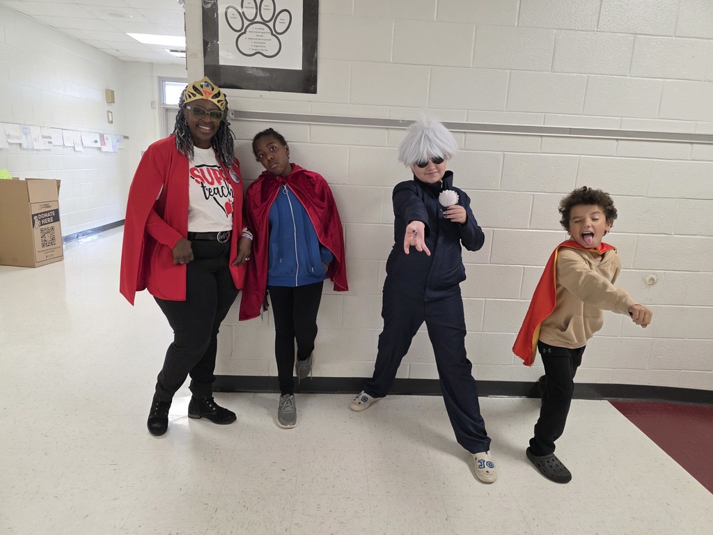Students and staff dressed as superheroes.