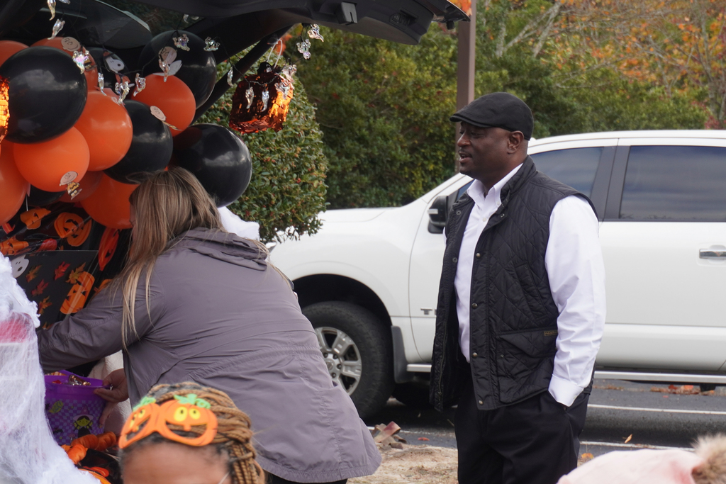 Superintendent talking with staff members.