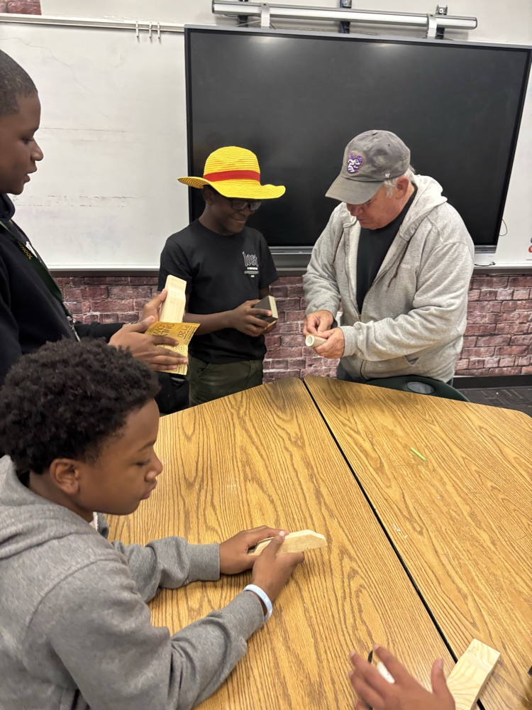 students working on pine box race cars 
