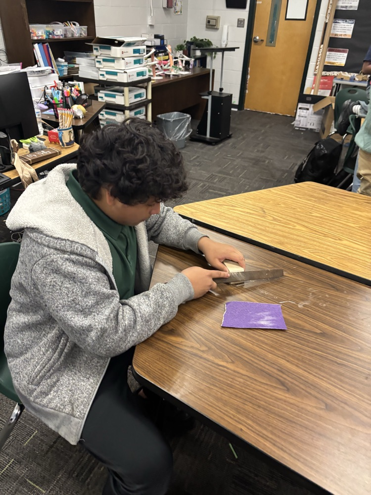 students working on pine box race cars 